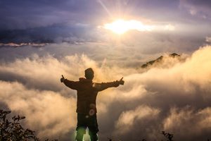 Man Standing Above Clouds