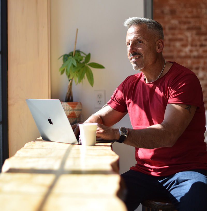 Dr. Jay LaGuardia On His Laptop