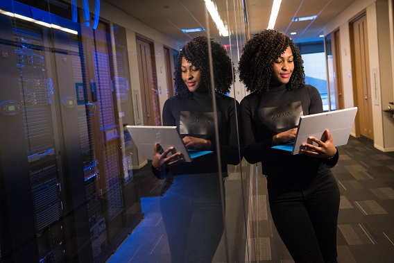 Woman with laptop mirror imaged double