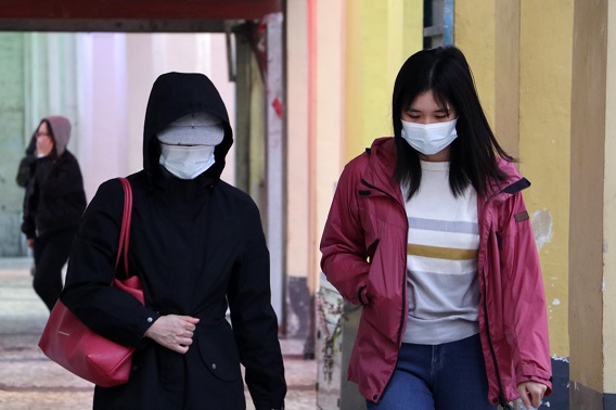 Two Women Walking in Medical Masks