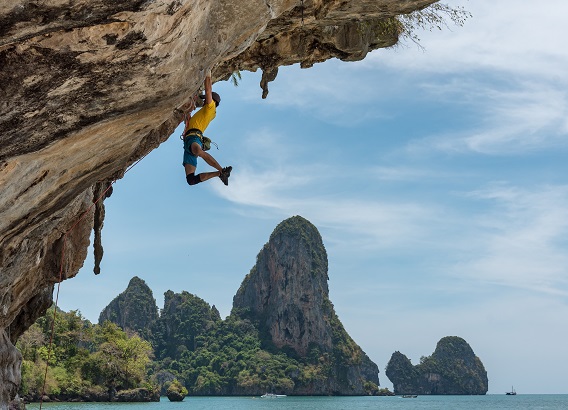 Man Hanging From Cliff