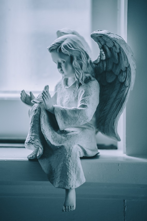 Angel Statue Holding A Dove