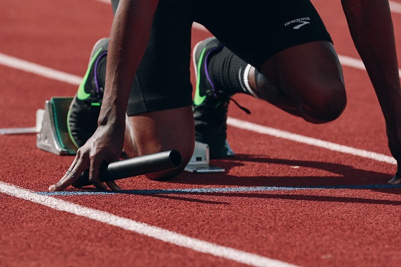 Person On Starting Block of Track