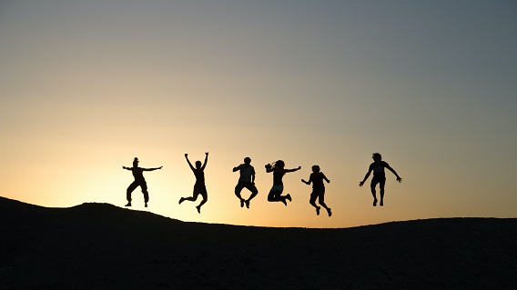 Silhouette of People Jumping