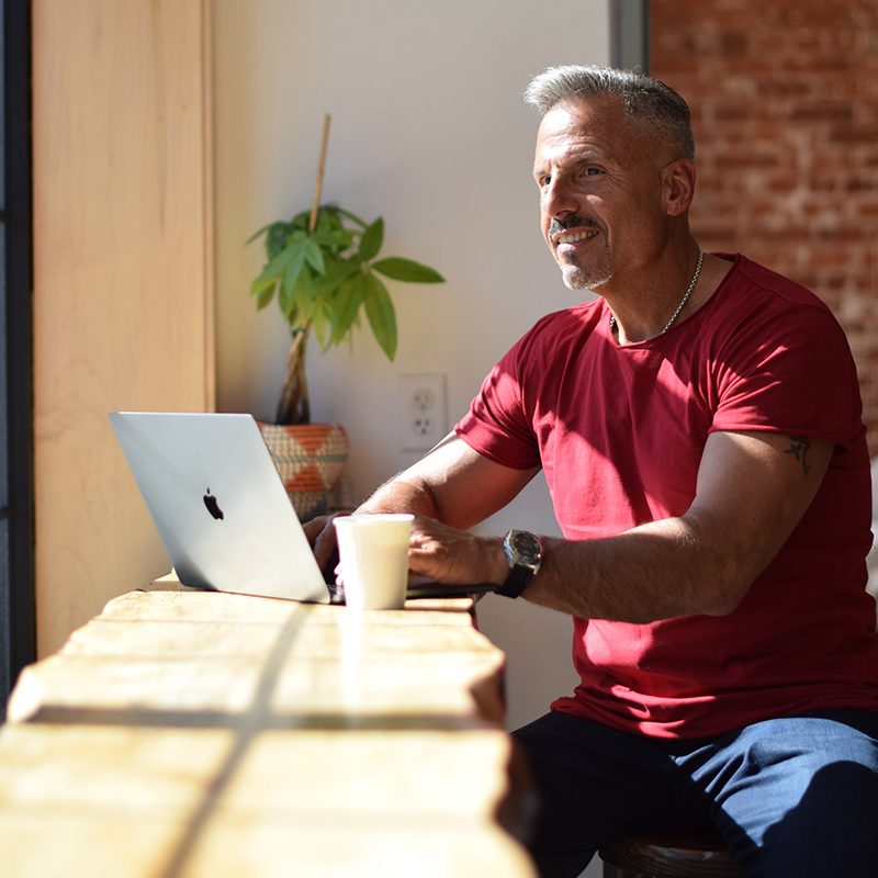 Dr. Jay LaGuardia On His Laptop