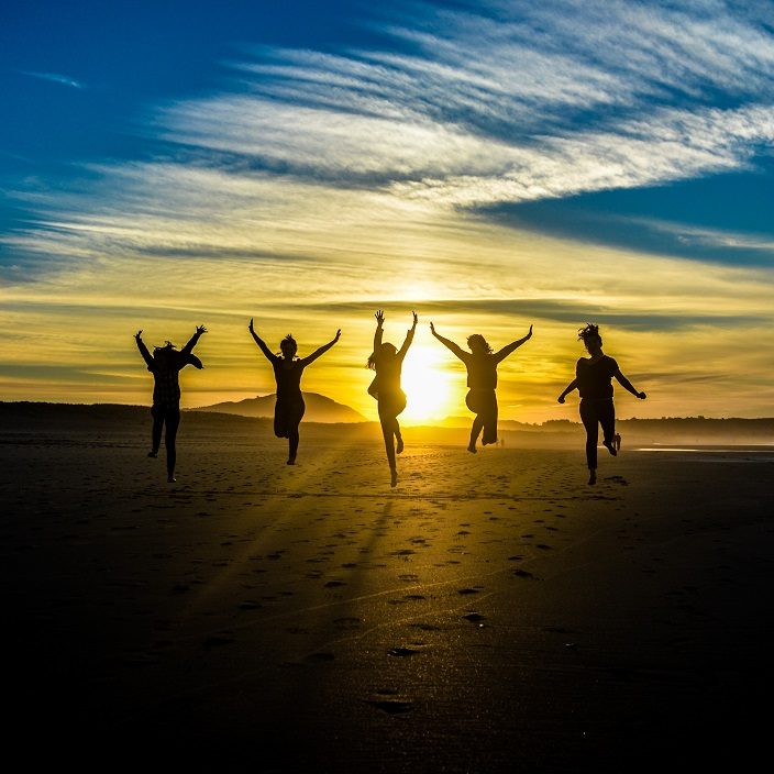 Sunset With People Silhouettes Jumping Beautiful Sunset With People Silhouettes Jumping hands outstretched.